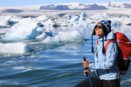 The girl admires the beauty of the glacial lagoon Jokulsarlon
