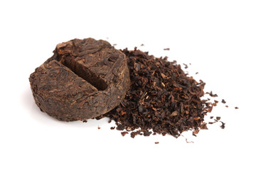 Round flat disc of puer tea isolated on white background. Pressed Chinese fermented Pu-erh tea