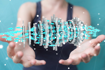 Businesswoman using floating modern gear mechanism 3D rendering