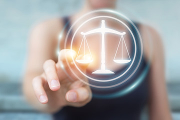 Businesswoman holding and touching 3D rendering law symbol