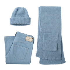 Knitted scarf, cap and jeans of blue color on isolated white background.