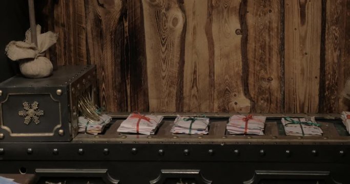 Moving conveyor belt with piles of children letters delivered to Santa Claus