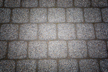Abstract background of old cobblestone pavement texture with natural patterns view from above