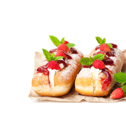 Custard  filled doughnuts with wild strawberry isolated on white