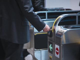 People insert ticket to Ticket Entrance at Subway station