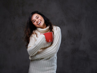 Fototapeta premium Emotional woman holds red coffee cup.