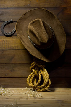 Accessories cowboy hanging on old wooden wall ranch