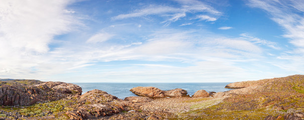 Coast of the Barents Sea with rocks in the water