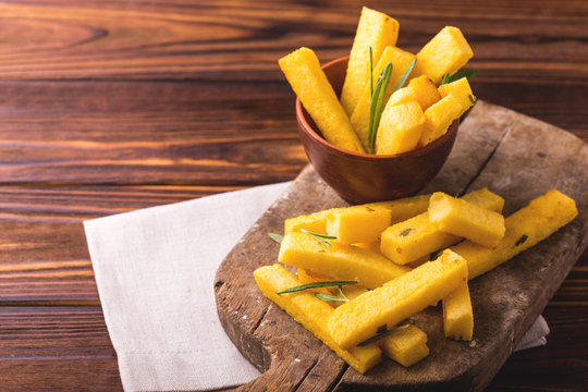 Polenta fries with rosemary. Italian appetizers. Horizontal view.