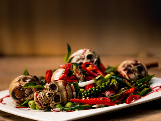 A dish of spicy skulls with herb to be a meal for wizard, witch in the party of Halloween...