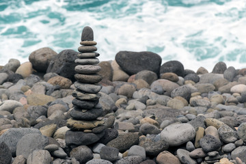 stack of zen stones on the beach