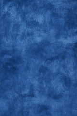 Grunge blue painted plaster wall background