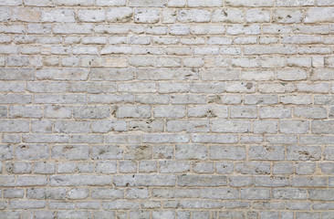 Wall of white travertine adarce stone bricks