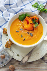 Pumpkin soup with chunks of baked pumpkin and spices.