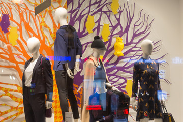 Fototapeta premium Five Mannequins Standing In Store Window Display Of Women's Casual Clothing Shop In Shopping Mall. Saint Petersburg, Russia. A new collection of clothing for men and women
