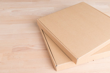 Cardboard box on a wood background