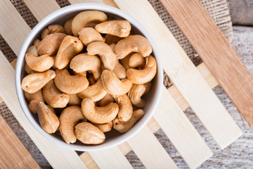 Roasted cashew nuts on rustic wood