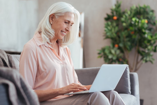 Joyful Senior Woman Surfing The Internet