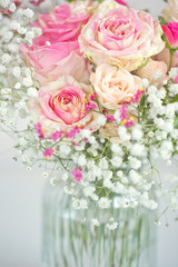 Lovely bunch of flowers .Close-up floral composition with a pink roses .Beautiful fresh pink roses on a table. 