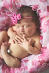 tender newborn sleeping on stylish background