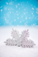 Fototapeta na wymiar Silver star Christmas ornament in snow