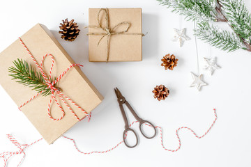 packaging christmas gifts in boxes on white background top view