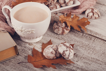 Autumn still life with cup of cocoa and chocolate cookies