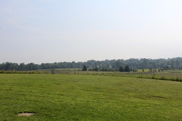 Fototapeta premium The grass field farmland out in the country.