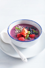 healthy berry smoothie bowl with strawberry blueberry raspberry and chia seed