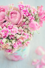 Lovely bunch of flowers .Beautiful fresh roses flowers in a box on a light background. 