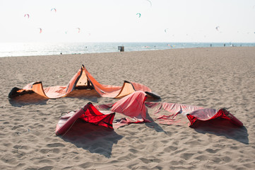 kitesurfing kites in sand awaiting the wind