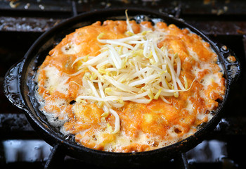 Fried mussel pancakes in hot plate, Thai style.