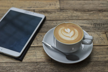 phone and coffee on wood
