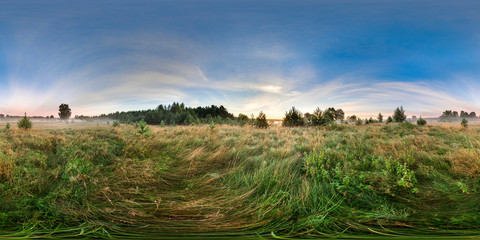 3D spherical panorama with 360 viewing angle. Ready for virtual reality or VR. Full equirectangular projection. Sunrise in the field. Little fog.