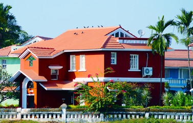 Bright colors. Blue house near the beach in Benaulim, South Goa, India. Big mansion. - obrazy, fototapety, plakaty