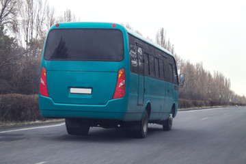 Bus driving on road.