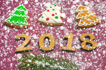 New Year card Inscription Happy new year 2018 on the background of snow and decor