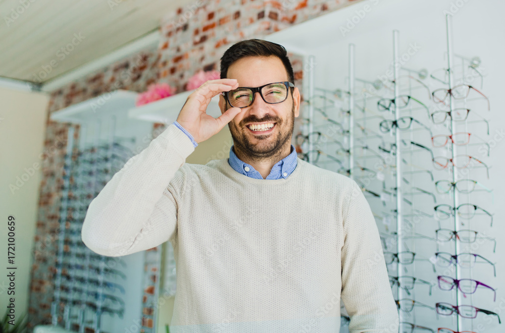 Wall mural man in optics store