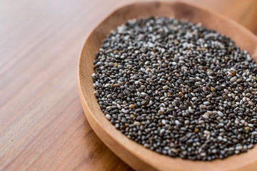 Chia Seeds in a wooden spoon.