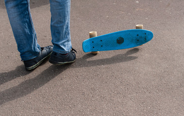 The guy learns to skateboard