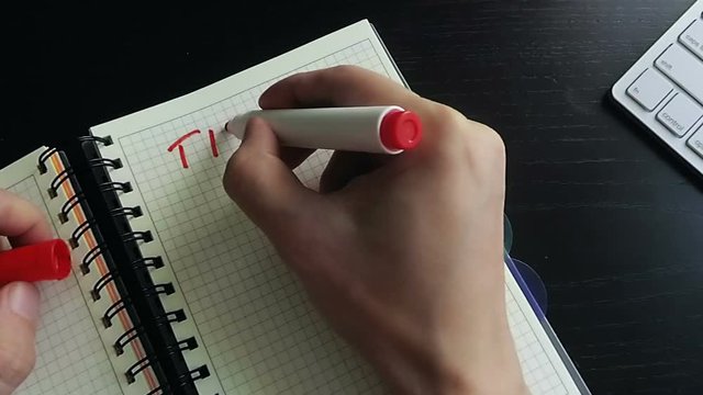 Man writing in a note Time to action. Business motivation.