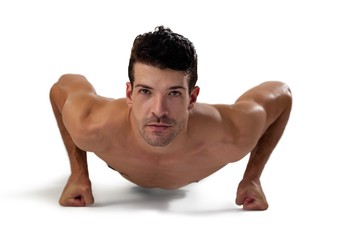 Obraz premium Portrait of determind shirtless player exercising planks