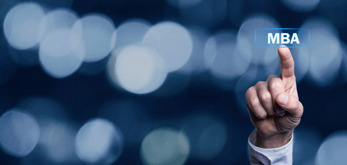 Hand touching MBA text.