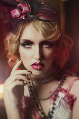 Retro portrait of a beautiful Gatsby woman. Vogue fashion style and smoke