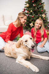 mother and daughter with dog