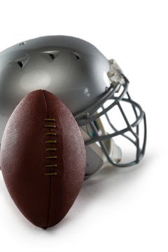 Close-up of football and sports helmet