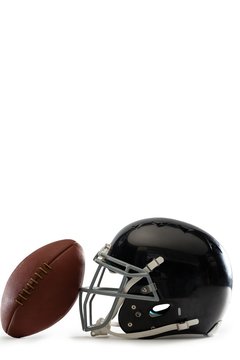 Close-up of American football and helmet
