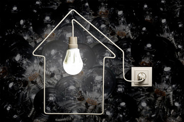 Glowing LED lamp in a house on background of incandescent bulbs
