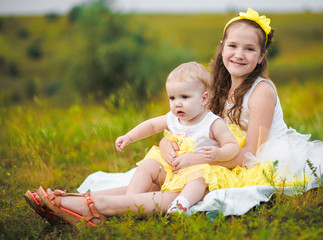 Little girls on green grass