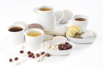 Diet pills with arrangement of coffee and tea cups